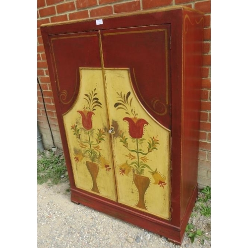 783 - A vintage oak wardrobe of small proportions, painted in distressed red, yellow and gold, with three ... 