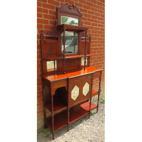 785 - An Edwardian walnut parlour display cabinet with broken pediment and finials, sectioned bevelled mir... 