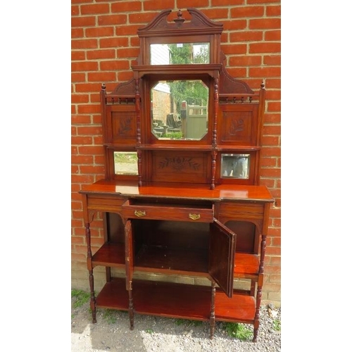 785 - An Edwardian walnut parlour display cabinet with broken pediment and finials, sectioned bevelled mir... 