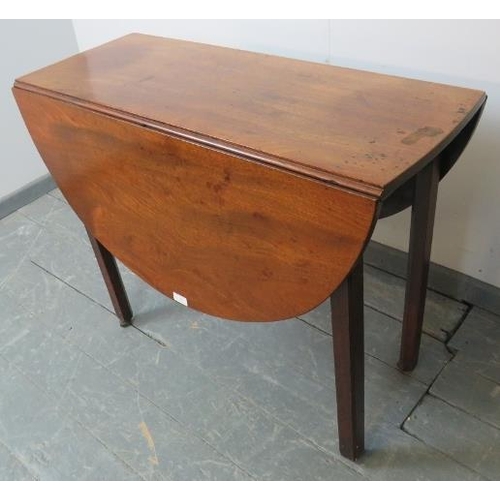 786 - A Georgian mahogany oval drop-leaf table, on inner chamfered square supports with reeded edges, term... 