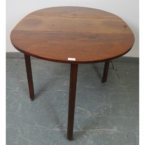 786 - A Georgian mahogany oval drop-leaf table, on inner chamfered square supports with reeded edges, term... 