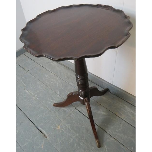 791 - A 19th century mahogany piecrust occasional table, on a tapering turned column with tripod base. 
Co... 