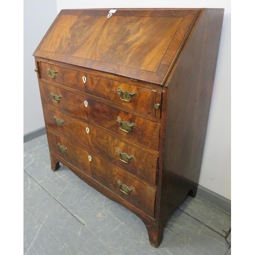 800 - A Georgian flame mahogany bureau, inlaid and crossbanded, the fall front opening onto a fitted inter... 