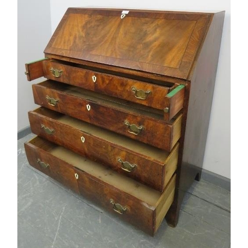 800 - A Georgian flame mahogany bureau, inlaid and crossbanded, the fall front opening onto a fitted inter... 