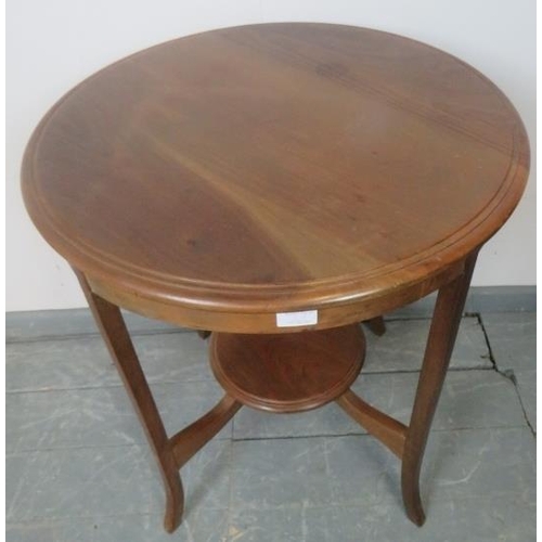 804 - An Edwardian mahogany circular two-tier occasional table, on splayed supports. 
Condition report: No... 