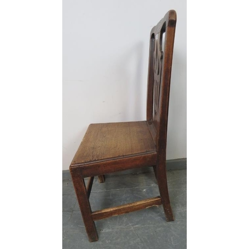 807 - An 18th century elm hall chair, with shaped and pierced back splat depicting a heart, on square supp... 