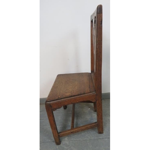 808 - An 18th century oak hall chair with shaped and pierced back splat, on square supports with an ‘H’ st... 