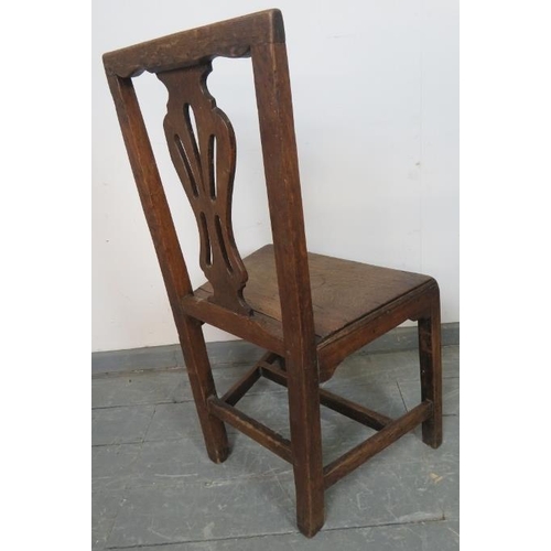 808 - An 18th century oak hall chair with shaped and pierced back splat, on square supports with an ‘H’ st... 