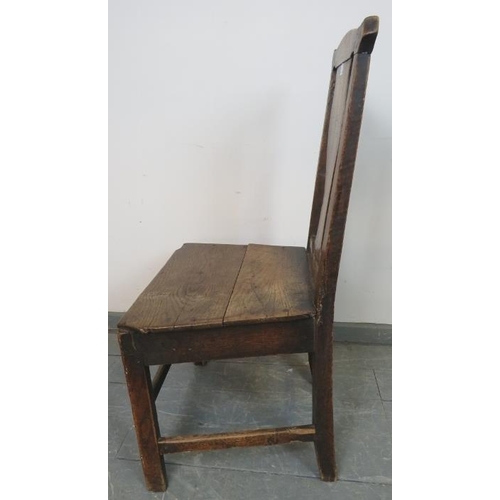 810 - An 18th century elm hall chair with shaped back splat, on inner chamfered square supports with stret... 