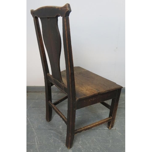 810 - An 18th century elm hall chair with shaped back splat, on inner chamfered square supports with stret... 