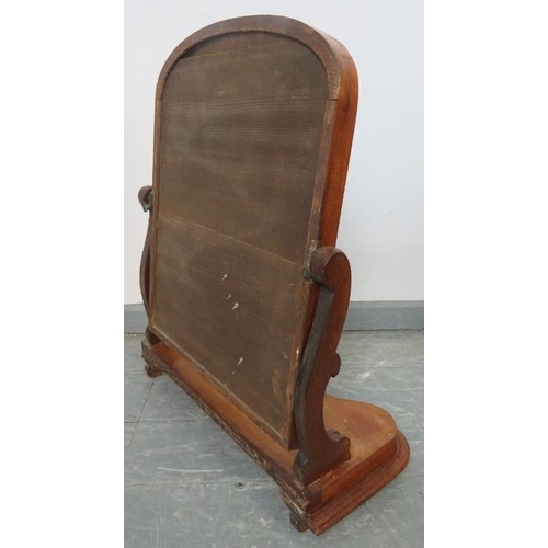 821 - A Victorian walnut swing vanity mirror with shaped uprights and serpentine plinth base, on scrolled ... 