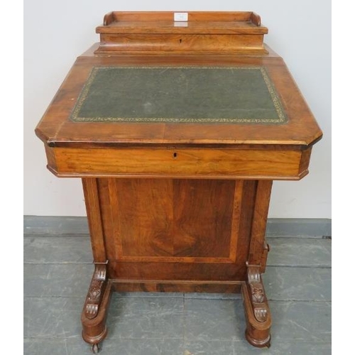 822 - A Victorian walnut Davenport with upper gallery and inset green leather writing surface, the lid ope... 