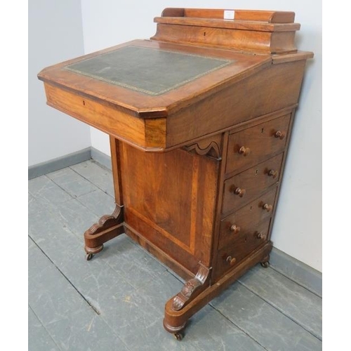 822 - A Victorian walnut Davenport with upper gallery and inset green leather writing surface, the lid ope... 