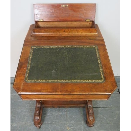 822 - A Victorian walnut Davenport with upper gallery and inset green leather writing surface, the lid ope... 