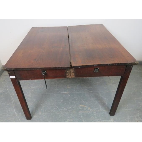 846 - A Georgian mahogany folding coaching table, on inner chamfered square supports. Can be assembled int... 