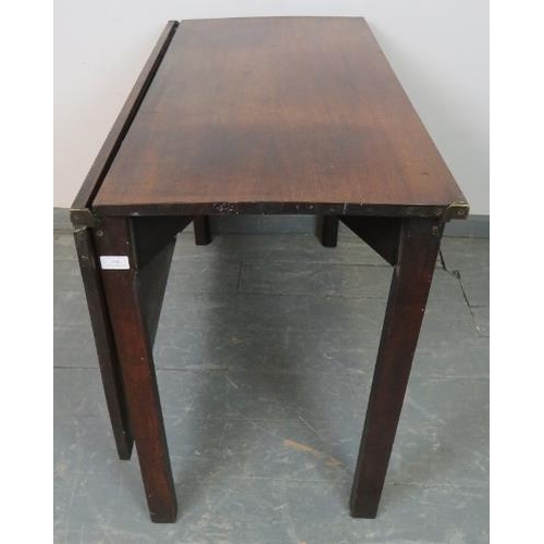 846 - A Georgian mahogany folding coaching table, on inner chamfered square supports. Can be assembled int... 