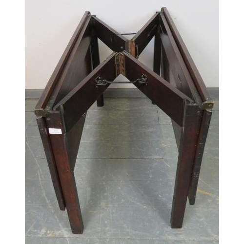 846 - A Georgian mahogany folding coaching table, on inner chamfered square supports. Can be assembled int... 