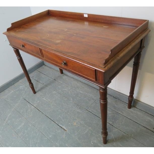 847 - A Victorian walnut writing desk with ¾ gallery and two cock-beaded frieze drawers with pressed brass... 