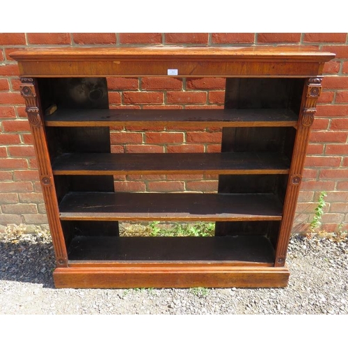 848 - A 19th century walnut low open bookcase of three height adjustable shelves, flanked by reeded column... 