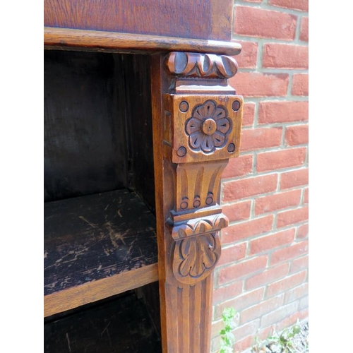 848 - A 19th century walnut low open bookcase of three height adjustable shelves, flanked by reeded column... 