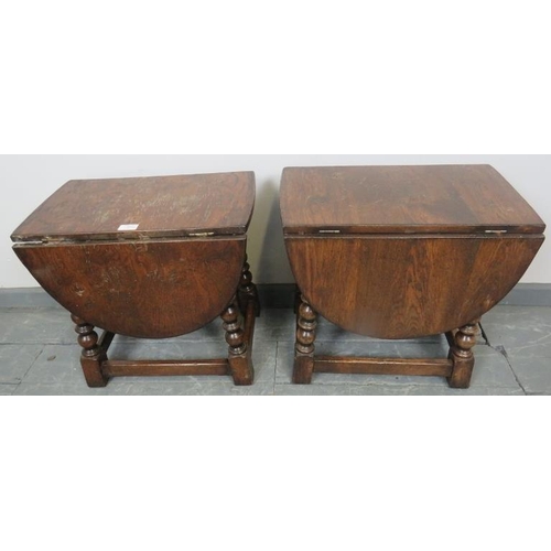 851 - A pair of vintage oak drop leaf oval side tables in an 18th century taste, on ball turned supports w... 