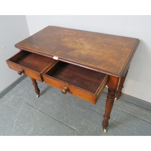 857 - A Victorian walnut hall table, the two short drawers with turned wooden knob handles, on tapering tu... 