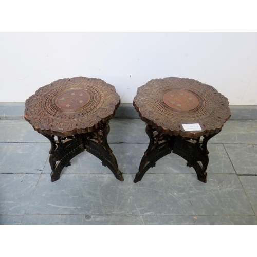 862 - A pair of vintage Anglo-Indian hardwood folding plant stands, featuring relief carving and brass inl... 