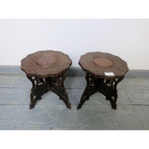 862 - A pair of vintage Anglo-Indian hardwood folding plant stands, featuring relief carving and brass inl... 