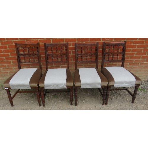 865 - A set of four Edwardian oak dining chairs, with carved and pierced backrests, upholstered in pale gr... 