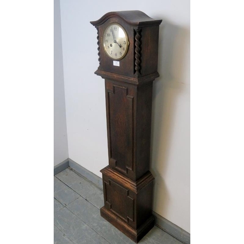 866 - A 1920s Jacobean-Revival oak cased striking 8-day grandmother clock with silvered dial and barley tw... 