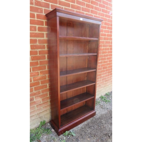 872 - A Victorian mahogany tall open bookcase of five height adjustable shelves, on a plinth base. 
Condit... 