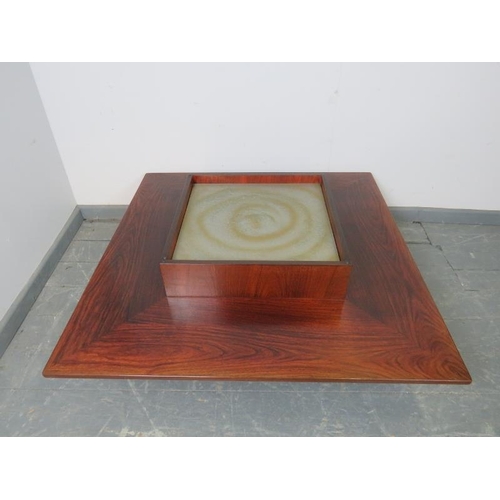 873 - A mid-century hardwood and walnut Danish coffee table by Mobelintarsia, with smoked glass top and si... 