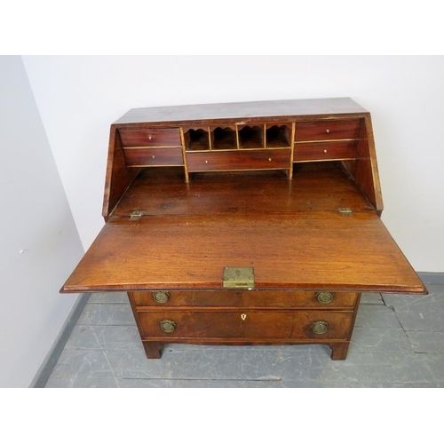 874 - A Georgian oak and flame mahogany bureau, with walnut crossbanding and satinwood inlay, the fall fro... 