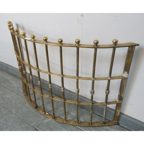 889 - A 19th century heavy gauge demi lune brass fire fender, with ball finials. 
Condition report: No iss... 