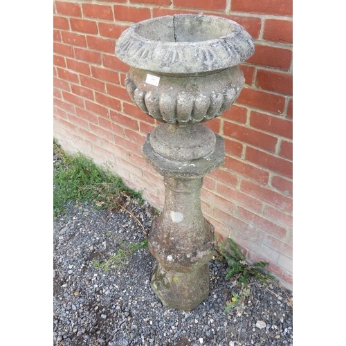 896 - A nicely weathered reconstituted stone pedestal of baluster form, together with an associated fluted... 