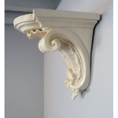 899 - A 19th century carved wooden corbel bracket shelf with shell carved and scrolled decoration, painted... 