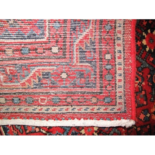 902 - A Persian Malayer runner, decorated with a busy stylised pattern on a red ground between multi-borde... 