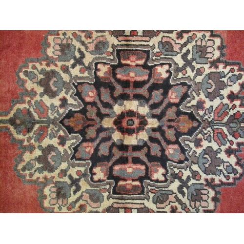 907 - A Persian Bakhtiar rug, decorated with a central stylised medallion on red ground between stylised f... 