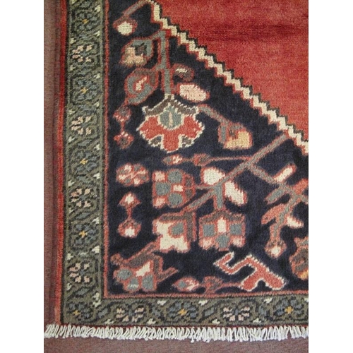 907 - A Persian Bakhtiar rug, decorated with a central stylised medallion on red ground between stylised f... 