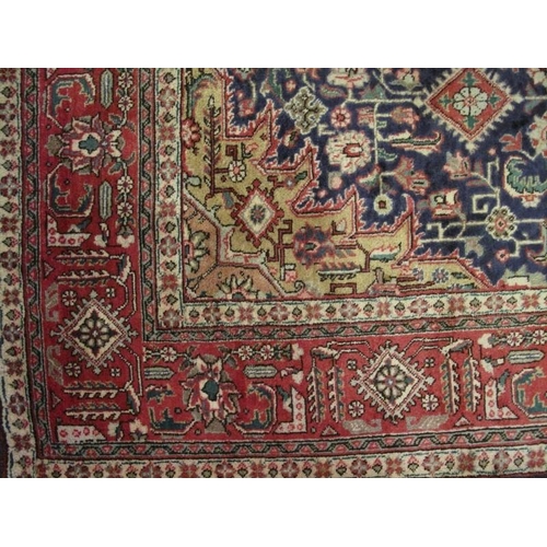 911 - A good Persian Tabriz carpet, decorated with a central shaped muted medallion amidst stylised motifs... 