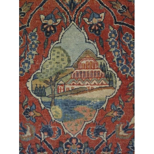 915 - A vintage Persian rug, probably early to mid 20th century, decorated with a central scenic medallion... 