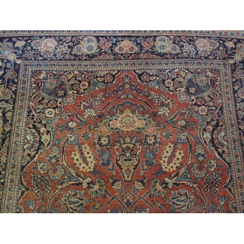 915 - A vintage Persian rug, probably early to mid 20th century, decorated with a central scenic medallion... 