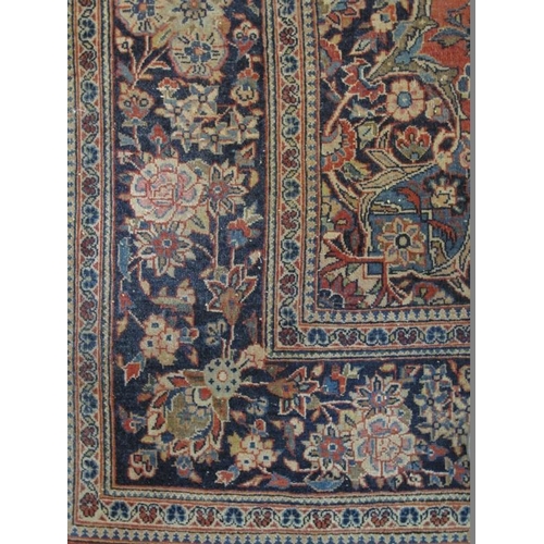 915 - A vintage Persian rug, probably early to mid 20th century, decorated with a central scenic medallion... 