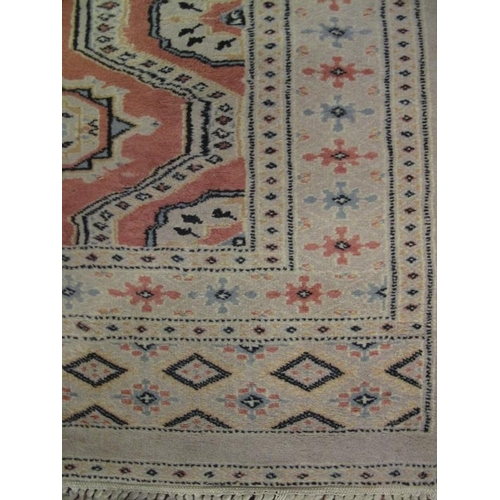 921 - A signed vintage Persian runner, decorated with a central panel of traditional motifs within stylise... 