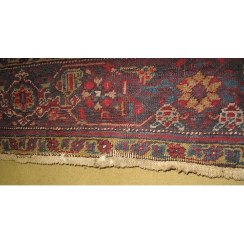 929 - A mid 20th century Persian carpet, central motif on a claret field. 189cm x 273cm.
Condition report:... 