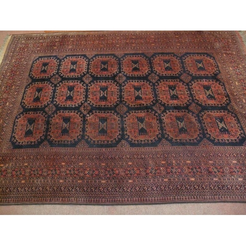 931 - A nice quality vintage Persian rug, decorated with a central field of 18stylised panels within multi... 