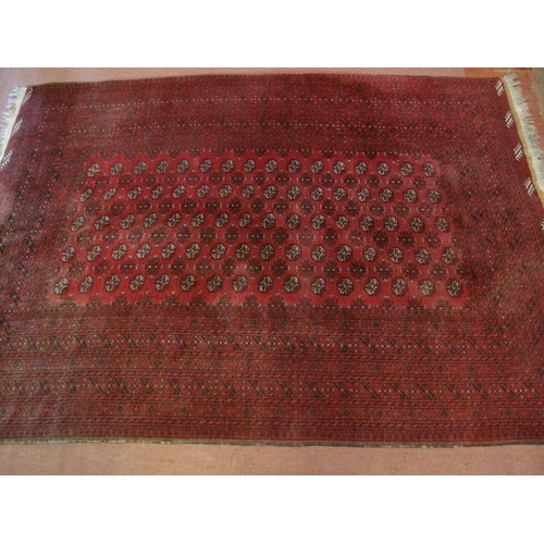 932 - A nice quality vintage Persian rug, decorated with a central field of stylised motifs within deep ba... 