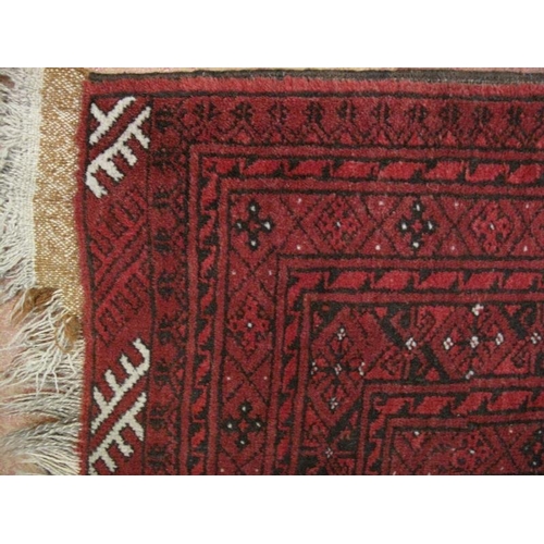 932 - A nice quality vintage Persian rug, decorated with a central field of stylised motifs within deep ba... 