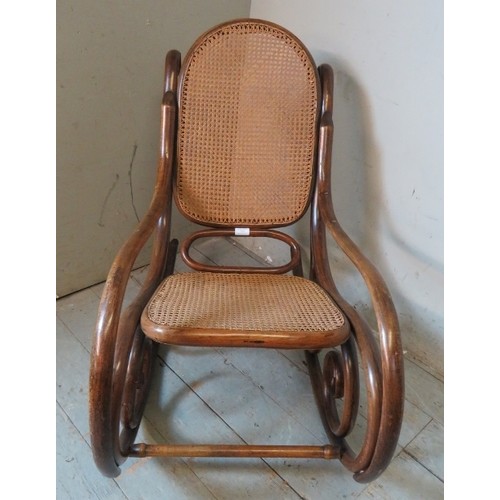 849 - A turn of the century bentwood rocking chair in the manner of Thonet with bergere back & seat panels... 