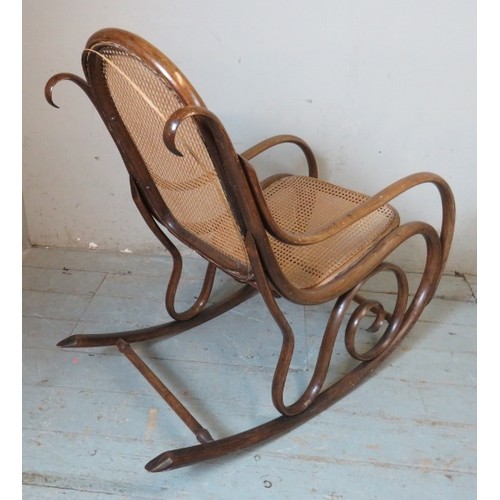 849 - A turn of the century bentwood rocking chair in the manner of Thonet with bergere back & seat panels... 